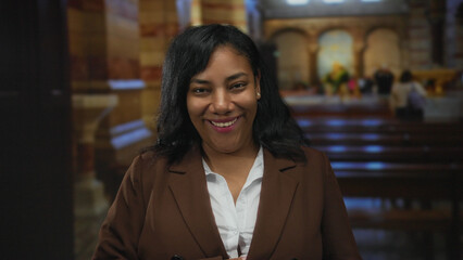 Woman face laughs aloud with hand on chest and head thrown back, eyes closed and mouth open wide in...