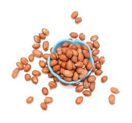 Dried peanuts in closeup on white