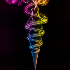 Obraz premium Vibrant colorful smoke swirls dynamically against black background