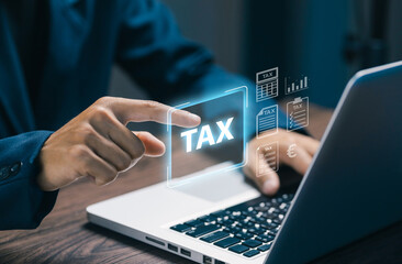 A business professional interacts with a digital TAX interface on a laptop, illustrating online tax filing, financial management, fintech solutions, and secure digital services.