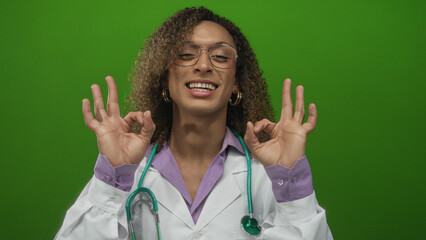 Woman doctor wearing glasses and stethoscope points finger directly at camera in a studio setting;...