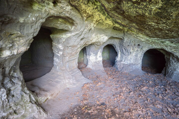 View of ancient rock dwellings, carved with precision and worn by time, stand as silent witnesses in Hontianske Tesare, Banska Bystrica Region, Slovakia.