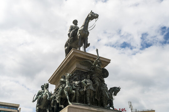 View of an equestrian statue atop a detailed pedestal, figures in bronze against a backdrop of a bright sky, a blend of art and history, Sofia, Sofia City Province, Bulgaria.