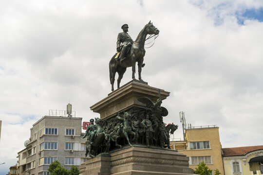 View of a bronze equestrian statue stands tall against a backdrop of buildings and a cloudy sky, a monument of history and artistry, Sofia, Sofia City Province, Bulgaria.