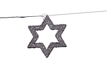 Star of david decoration hanging from wire against sky