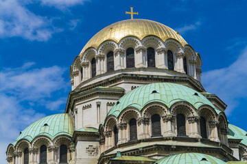 View of the majestic domes, gold and green, rise against the vibrant blue sky, a testament to architectural grandeur, Sofia, Sofia City Province, Bulgaria.