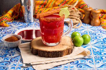 Homemade Michelada with Beer and  clamato, cocktail from mexico