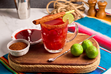 Michelada, typical mexican cocktail made with beer and tomato juice