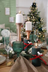 Festive table setting with Christmas decor indoors, closeup