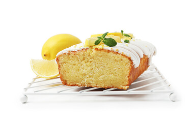 Delicious lemon cake with glaze, fresh fruit slices and mint isolated on white