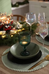Festive table setting with Christmas decor indoors, closeup