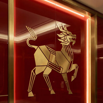 geometric golden qilin on red wall