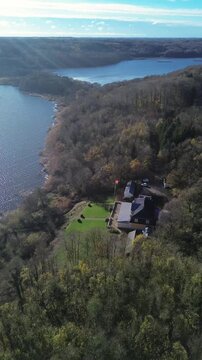 Scenic landscape with elegant buildings and lush greenery. The property includes traditional Danish architecture
