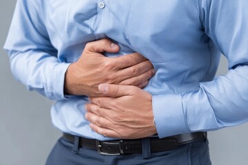 Plakat Man with stomach pain clutching his abdomen