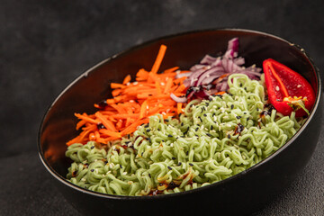 vegetarian noodles jade noodles with vegetables green noodles healthy food budha bowl main course appetizer fresh delicious gourmet food table background rustic food top view copy space