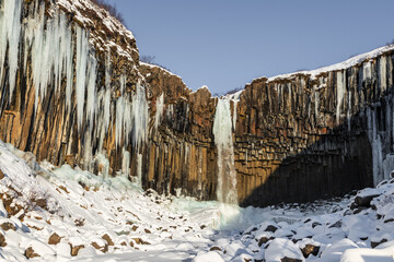 Frozen winter view of Sfartifoss waterfall, Iceland.