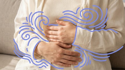 Person in beige clothes holding stomach with blue graphic swirl lines