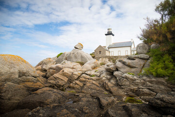 The Pontusval Lighthouse is a historic and picturesque lighthouse located in Brittany, France. View in its stunning natural setting on a sunny day, 