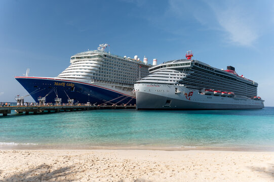 Virgin Voyages Scarlet Lady docked next to the Carnival Mardi Gras at the Gran Turk Cruise Port