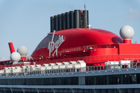 Close up of the Red Hull of the Virgin Voyages Scarlet Lady, approaching the dock at the Gran Turk Cruise Port 
