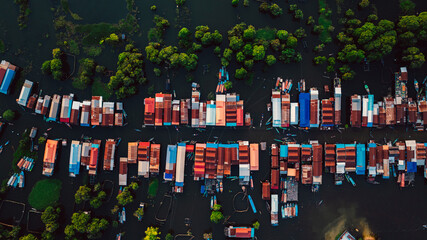 Kampong Phluk floating village with stilt houses on Tonle Sap lake in Cambodia.