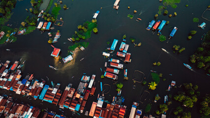 Kampong Phluk floating village with stilt houses on Tonle Sap lake in Cambodia.
