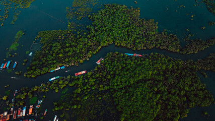 Kampong Phluk floating village with stilt houses on Tonle Sap lake in Cambodia.