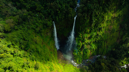 Zipline flights. Tad Fane waterfall in rainforest at Pakse and Champasak city Laos. Tour tourism and travel in Asia.