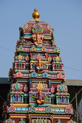 Colorful Hindu Temple Tower with Intricate Sculptures in India