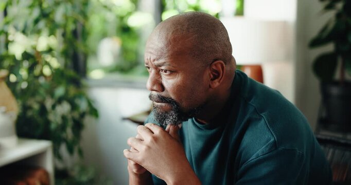 Home, thinking and black man frustrated with reflection, decision and sad with mental health. Mature person, living room and regret with nostalgia, memory and doubt with daydreaming in house lounge