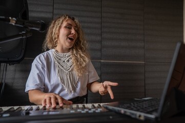 Caucasian woman teaches online music lesson..