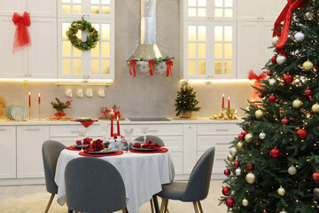 Festive table setting with Christmas decor in kitchen. Interior design