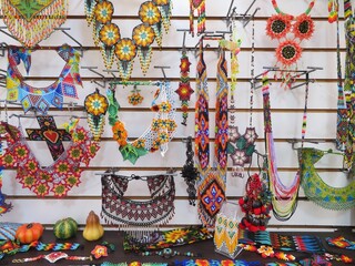 traditional mexican handmade huichol / wixarika colorful bead jewelry in a market
