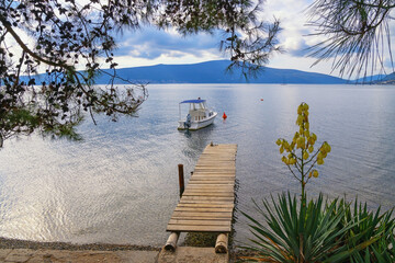 Cloudy autumn Mediterranean landscape. Montenegro, Adriatic Sea. View of Bay of Kotor near Tivat city. Overcast.  Donja Lastva village