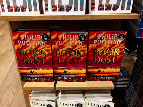 Display of The Book of Dust by Philip Pullman and The Land of Sweet Forever by Harper Lee in a bookstore