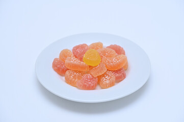 Sweets colorful homemade marmalade on a plate on a white background