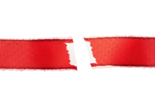 Torn red fabric ribbon isolated on transparent background with frayed edges