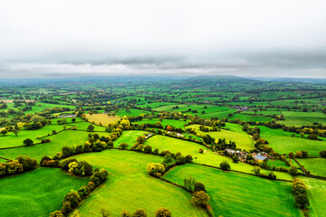 Obraz premium Autumn colours over Wales Farms and Fields from a drone, Grosmont, Abergavenny, Monmouthshire, Wales, UK 