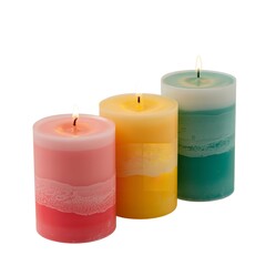 Multicolored Layered Candles Burning on White Background