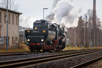 old steam train Dampflok with a lot of steam in saxony bischofswerda 528141-5 Dampflok