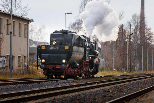 old steam train Dampflok with a lot of steam in saxony bischofswerda 528141-5 Dampflok