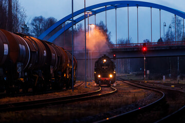 old steam train at night with lights 528141-5 Dampflok in saxony germany
