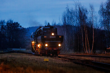 old steam train at night with lights 528141-5 Dampflok in saxony germany
