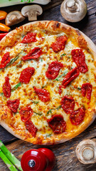 Sun dried tomato pizza with  mozzarella