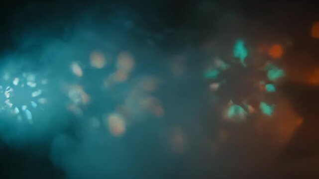A muted scene with teal and orange light, soft focus, and shifting star bokeh that morphs in hazy space. Lights drift in a smoke-filled frame of light