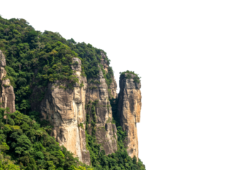 Towering rock formations rise majestically, adorned with lush green tropical jungle foliage, creating a dramatic and vibrant natural landscape.
