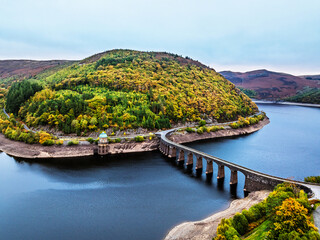 Autumn over Garreg Ddu Dam from a drone, Elan Valley, Caban-Coch Reservoir, Rhayader, Wales, UK	