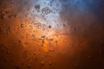 Colorful ice texture. Frozen bubbles in ice. Dark abstraction