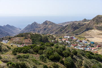 Mountain valley with village and terraced fields overlooking the Atlantic Ocean near Mirador de Jardina, Tenerife, Canary Islands, Spain. © Sergey Kohl