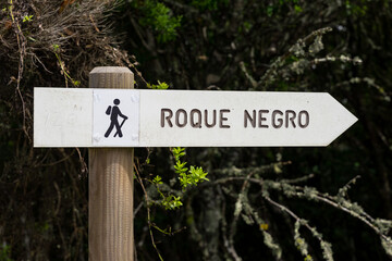 Hiking trail direction sign pointing to Roque Negro in Anaga Rural Park, Tenerife, Canary Islands, Spain.